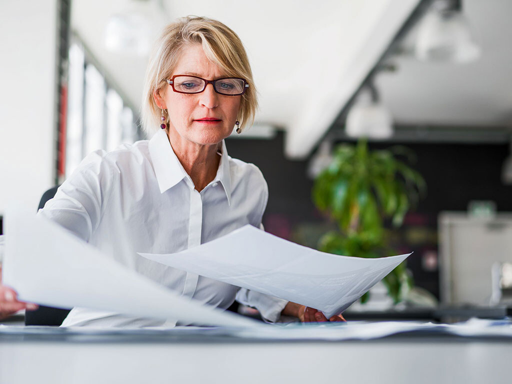 Woman looking through papers