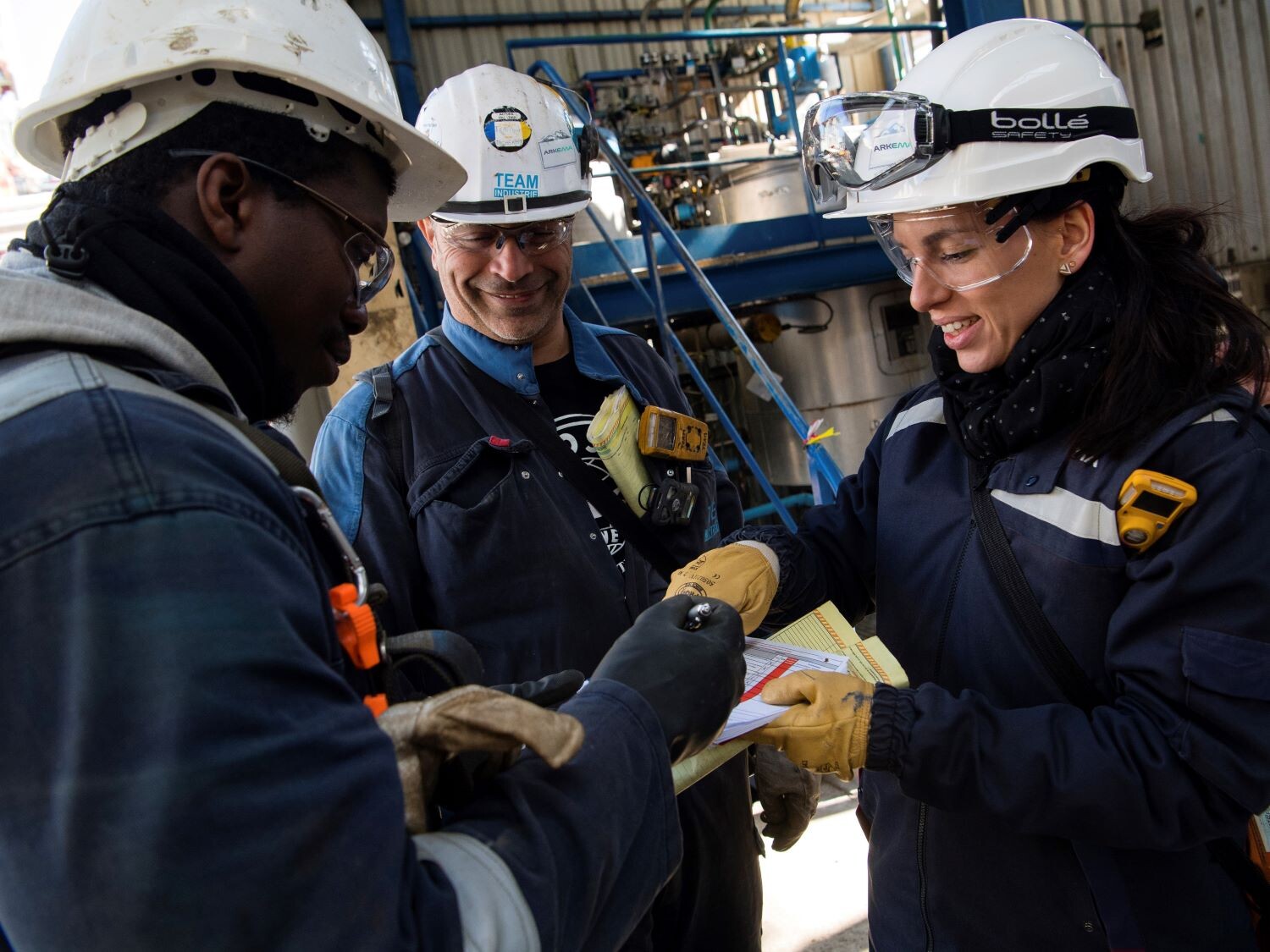 two workers are shaking hands