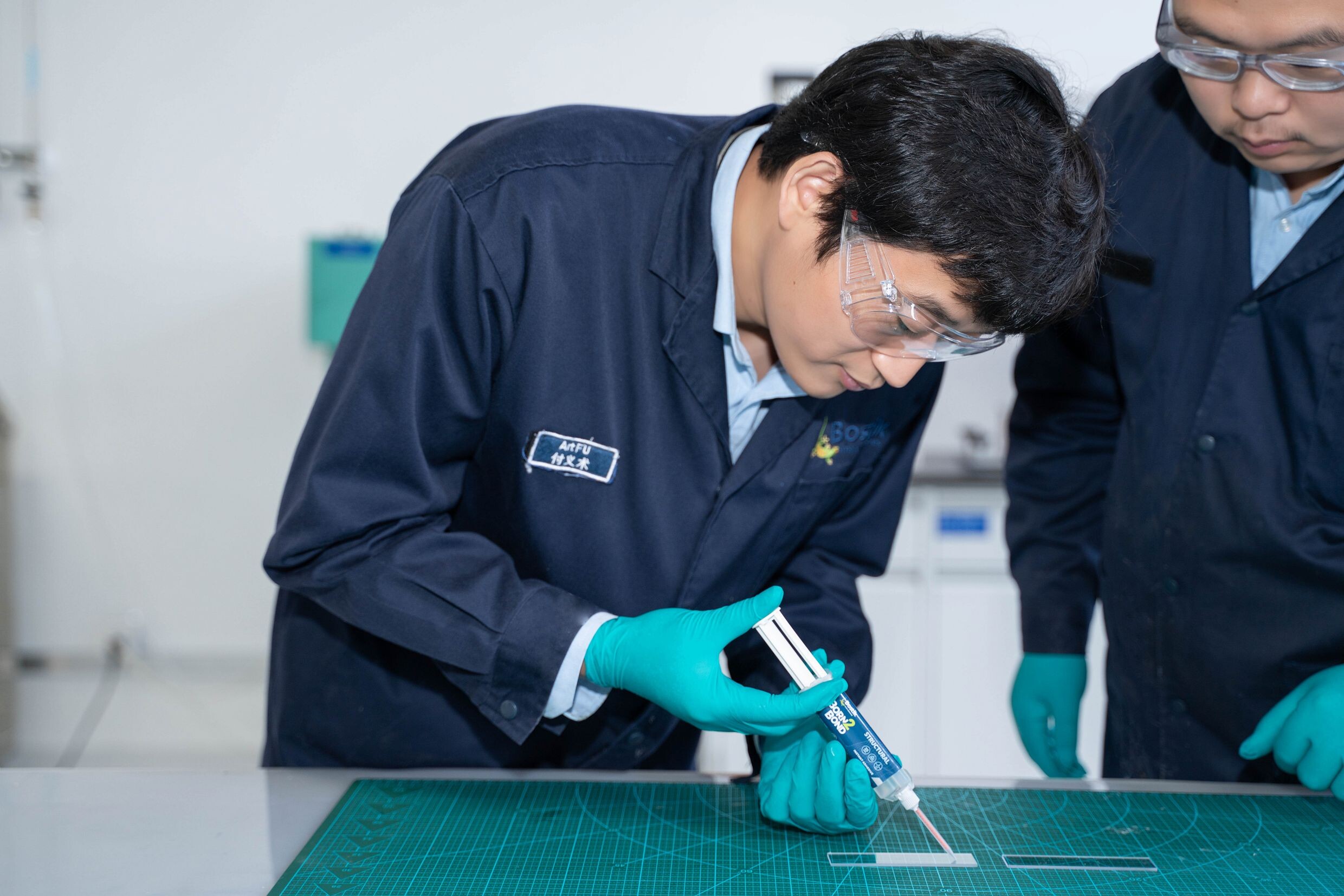 bostik workers in a lab in Shanghai