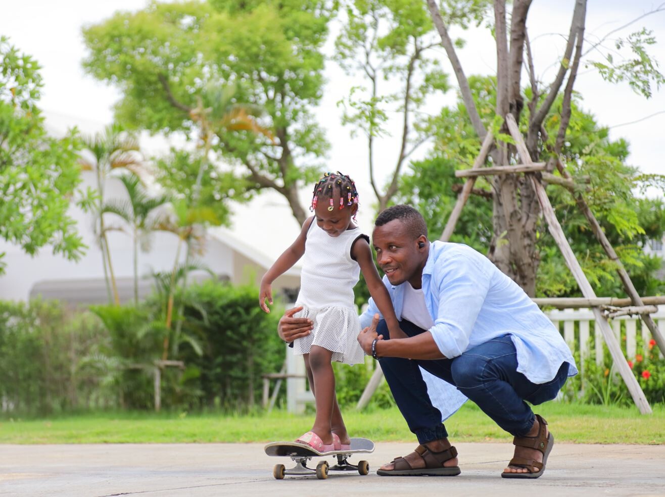 Father with young child on skateboard