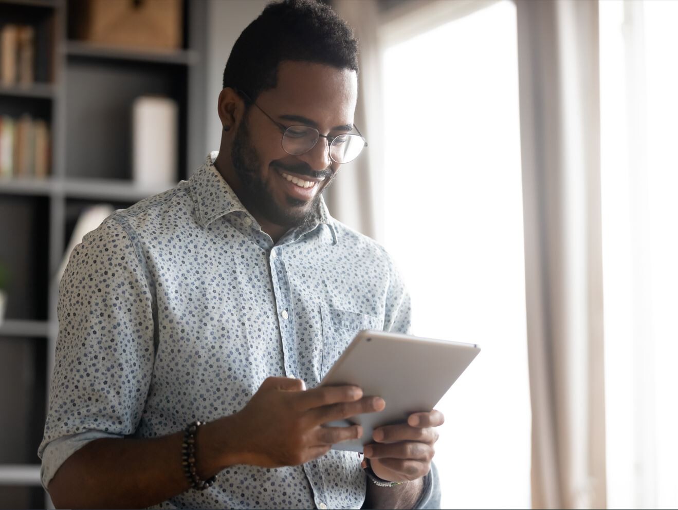 African American looking at iPad