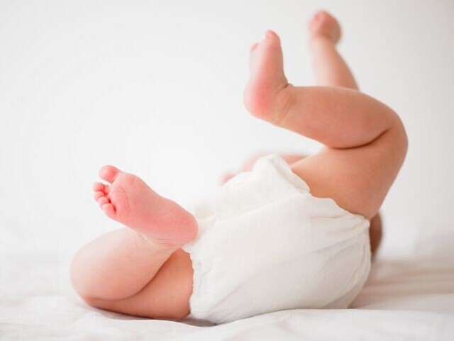 Baby in diapers assembled with Bostik adhesives, Arkema subsidiary