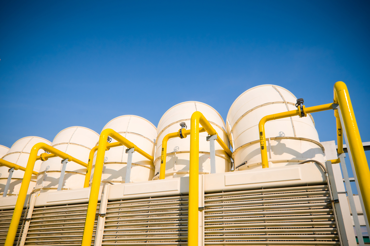 Big yellow pipes on blue sky background