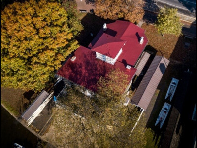 white building with white roof coating