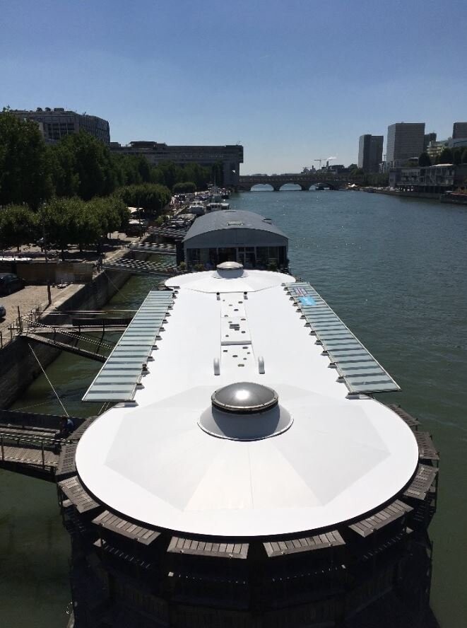 Reflective cool roof on a barge